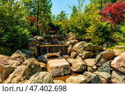 A stream flowing through a bed littered with rocks. Стоковое фото, фотограф Владимир Ушаров / Фотобанк Лори