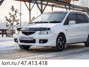KRASNOYARSK, RUSSIA - February 2, 2025: White Mazda Premacy. Редакционное фото, фотограф Плотников Дмитрий / Фотобанк Лори