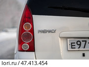KRASNOYARSK, RUSSIA - February 2, 2025: White Mazda Premacy. Редакционное фото, фотограф Плотников Дмитрий / Фотобанк Лори