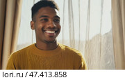 Close up portrait of young happy smiling black african american professional guy looking at camera at work in office. Стоковое AI-видео, аниматор ALLA YURTAYEVA / Фотобанк Лори