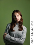 Teen Girl Expressing Emotion in a Studio Setting With Neutral Backdrop. Стоковое фото, фотограф Aleksandr Golubev / Фотобанк Лори