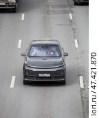 EV crossover SUV Li Auto L7 driving in motion blur on highway road, aerial front view. Редакционное фото, фотограф Константин Григорьев / Фотобанк Лори
