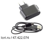 Блок питания на белом фоне. AC/DC adapter  on white background. Стоковое фото, фотограф Татьяна Д / Фотобанк Лори