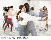 Positive couple of dancers learns a slow foxtrot. Стоковое фото, фотограф Яков Филимонов / Фотобанк Лори
