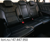 Novosibirsk, Russia -  March  23, 2024: Mercedes-Benz GL-class, close-up of the black  rear seats with seats belt. modern car interior. Стоковое фото, фотограф Виталий Сова / Фотобанк Лори