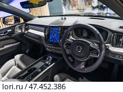 Volvo XC60 cockpit with touchscreen display and modern controls. London, UK, 31 December 2023. Редакционное фото, фотограф Zydrius Tartenis / Фотобанк Лори