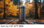 Reusable metal thermos filled with water on a rainy autumn day. Многоразовый металлический термос, наполненный водой в дождливый осенний день. Стоковое AI-изображение, AI-художник Katsiaryna Repich / Фотобанк Лори