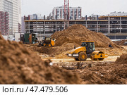 Heavy machinery for excavation and landscaping. Close-up of a road roller on a construction site in the sand. Excavation and road construction. Стоковое фото, фотограф Photojuli / Фотобанк Лори