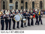 STOCKHOLM, SWEDEN - APRIL 30, 2018: Military musicians from the Royal Swedish Army Orchestra perform at the ceremony to celebrate the 72nd birthday of King Carl XVI Gustaf at the Royal Palace in Stockholm. Редакционное фото, фотограф Сергей Комаров / Фотобанк Лори