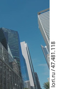 Skyscrapers soar in urban cityscape. Стоковое видео, видеограф Михаил Коханчиков / Фотобанк Лори