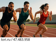 Three Athletes Sprinting on a Track During Sunset in a Competitive Training Session. Стоковое AI-изображение, AI-художник Юлия Гапеенко / Фотобанк Лори