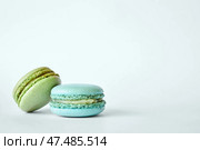 Two delicious colorful French Macarons, macaroons cakes with different flavors. Стоковое фото, фотограф Екатерина Якименко / Фотобанк Лори