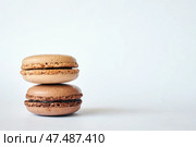 Stack of two brown French Macarons, cakes with coffee and creme brulee flavor. Стоковое фото, фотограф Екатерина Якименко / Фотобанк Лори