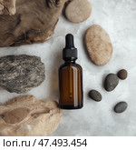 Skincare bottle mockup resting amidst calming natural stones on a smooth surface. Skincare bottle resting amidst calming natural stones on a smooth surface. Стоковое AI-изображение, AI-художник Katsiaryna Repich / Фотобанк Лори