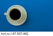 Cup of coffee on a blue background. Стоковое фото, фотограф Юлия Николаева / Фотобанк Лори