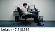 Unhappy man in his thirties in the office at his desk. Central minimalistic composition. Horizontal layout. Stress vibe. Стоковое AI-изображение, AI-художник Катерина Ковалева / Фотобанк Лори
