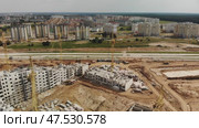 Construction of apartment buildings. Drone view. Стоковое видео, видеограф Mikhail Davidovich / Фотобанк Лори