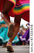 Dancer Feet in Huaraches Mid-Step During Folkloric Dance; Used by Dance Schools, Cultural Festivals, and Event Planners. Стоковое AI-изображение, AI-художник Sergey Grishin / Фотобанк Лори