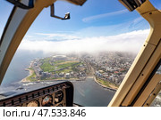 View from the cockpit of the helicopter on Cape Town and clouds (2023 год). Стоковое фото, фотограф Екатерина Якименко / Фотобанк Лори