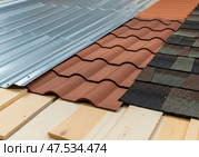 Different roofing materials samples on wooden base, comparison of roof covering types. Стоковое AI-изображение, AI-художник Гайфуллина Дина / Фотобанк Лори