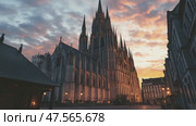 Majestic cathedral at sunset, a serene urban landscape. Стоковое AI-видео, аниматор Юрий Поздников / Фотобанк Лори