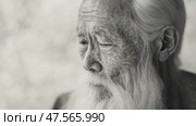Elderly asian man expressing thoughtful concern in monochrome. Стоковое AI-видео, аниматор Юрий Поздников / Фотобанк Лори