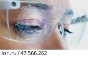 Woman wearing futuristic smart glasses with fingerprint scan technology. Стоковое AI-видео, аниматор Юрий Поздников / Фотобанк Лори