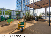 Modern playground featuring unique equipment designed for children's enjoyment in an urban environment. Стоковое фото, фотограф Алексей Климкин / Фотобанк Лори