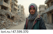 A Young Man Stands Confidently Among the Ruins of Buildings in a War-Torn Area, Expressing Resilience and Strength. Стоковое AI-изображение, AI-художник Sergey Grishin / Фотобанк Лори