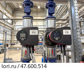 An Industrial water pump system inside a modern facility. Стоковое фото, фотограф Виктор Ветошкин / Фотобанк Лори