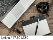 Graphic designer workplace with laptop and graphic tablet. Стоковое фото, фотограф Александр Собко / Фотобанк Лори
