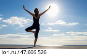 A woman doing yoga, stretching, pacification, calmness. Стоковое AI-изображение, AI-художник Ирина Ручушкина / Фотобанк Лори