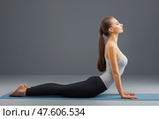 A woman doing yoga, stretching, pacification, calmness. Стоковое AI-изображение, AI-художник Ирина Ручушкина / Фотобанк Лори