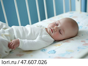 Baby sleeping peacefully in a crib during morning light. Младенец мирно спит в кроватке при утреннего освещения. Стоковое AI-изображение, AI-художник Katsiaryna Repich / Фотобанк Лори