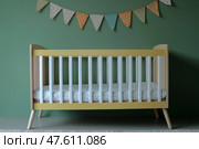 Scandinavian style newborn baby room with playful decor and organized chaos. Комната для новорожденного в скандинавском стиле с игривым декором и организованным хаосом. Стоковое AI-изображение, AI-художник Katsiaryna Repich / Фотобанк Лори