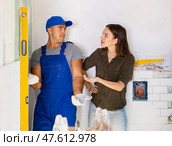 Woman dissatisfied with work done by the builder to renovate bathroom. Стоковое фото, фотограф Яков Филимонов / Фотобанк Лори