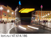 France, Nice, 12.09.2015: Place Massena at night, Avenue Jean Medecin, trams, tourists. Редакционное фото, фотограф Vladimir Drozdin / Фотобанк Лори