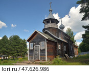 Uchma village, Myshkin district, Yaroslavl region,  Russia, July 25, 2024: Wooden church in name of Saint Anastasia Deliverer from Bonds and Saint Cassian of Uglich. Редакционное фото, фотограф Алексей Антипов / Фотобанк Лори
