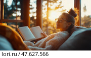 Relaxing Time: A woman finds peace and inspiration while journaling in a cozy sunlit room. Стоковое AI-изображение, AI-художник Данила Большаков / Фотобанк Лори