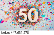Celebrating 50 years with colorful confetti explosion. Стоковое AI-изображение, AI-художник Юрий Поздников / Фотобанк Лори