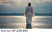 A person wearing a biblical robe walking in the water with a blurred background shot from behind. Стоковое AI-видео, аниматор Ирина Старикова / Фотобанк Лори