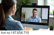 Employer Listening to Smiling Applicant During a Remote Job Interview From a Clean Home Office, Highlighting Virtual Hiring. Стоковое AI-изображение, AI-художник Sergey Grishin / Фотобанк Лори