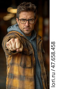 Intent look of a man pointing towards the viewer, showcasing determination and direct communication in a studio setting. Стоковое AI-изображение, AI-художник Данила Большаков / Фотобанк Лори