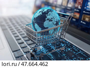 A laptop screen shows a shopping cart with a globe on it. Стоковое AI-изображение, AI-художник Ярославский Максим / Фотобанк Лори