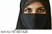 A woman in a black niqab with only her eyes visible. Женщина в черном никабе, у которой видны только глаза. Стоковое AI-изображение, AI-художник Katsiaryna Repich / Фотобанк Лори