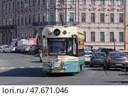 SAINT PETERSBURG, RUSSIA - APRIL 16, 2025: Modern tram 71-421P-01 "Dovlatov" on a city street on a sunny April day. Редакционное фото, фотограф Виктор Карасев / Фотобанк Лори