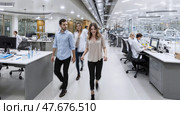 People walk across office open space. Intentional motion blur. Scientific workplace. Стоковое AI-изображение, AI-художник Катерина Ковалева / Фотобанк Лори