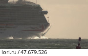 15 April 2025 - Lisbon, Portugal - Majestic cruise ship navigating through ocean waves at sunset. Редакционное видео, видеограф Константин Шишкин / Фотобанк Лори