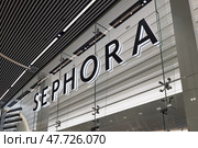Sephora Store Sign Illuminated in Shopping Mall. London, UK, 10 February 2024. Редакционное фото, фотограф Zydrius Tartenis / Фотобанк Лори