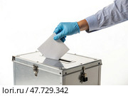 Casting a Vote in a Ballot Box During Election Day Generative AI. Стоковое AI-изображение, AI-художник Roman Zavorotny / Фотобанк Лори